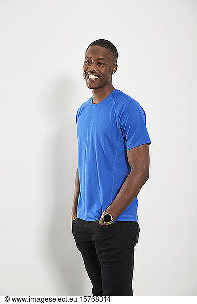 Portrait happy young man in blue t-shirt