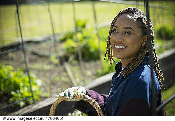 Portrait happy young woman gardening