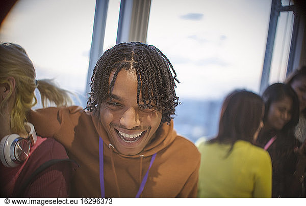 Portrait laughing young man with friends