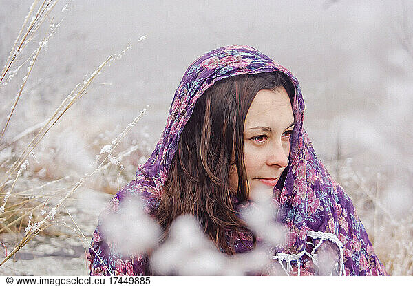 portrait of a beautiful woman on a background of snow