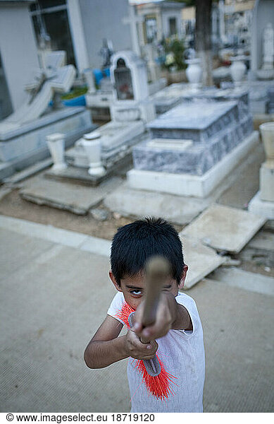 Portrait of a boy who cleans in the cemetery with his mother  Panteon General  Oaxaca  Mexico.