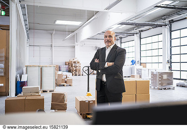 Portrait of a confident businessman in a factory
