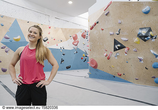 Portrait of a confident woman in climbing gym