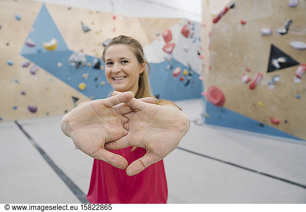 Portrait of a confident woman in climbing gym
