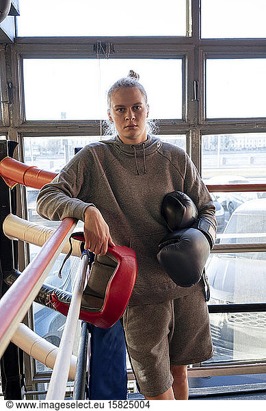 Portrait of a female boxer in gym