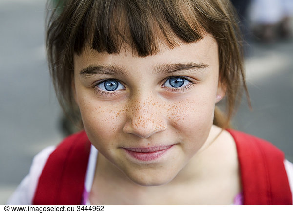 Portrait of a girl with big blue eyes and freckles  Sweden.