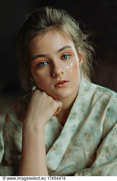 portrait of a girl with glitter on her face