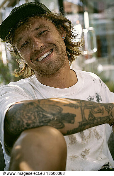 Portrait of a happy young man with freckles.