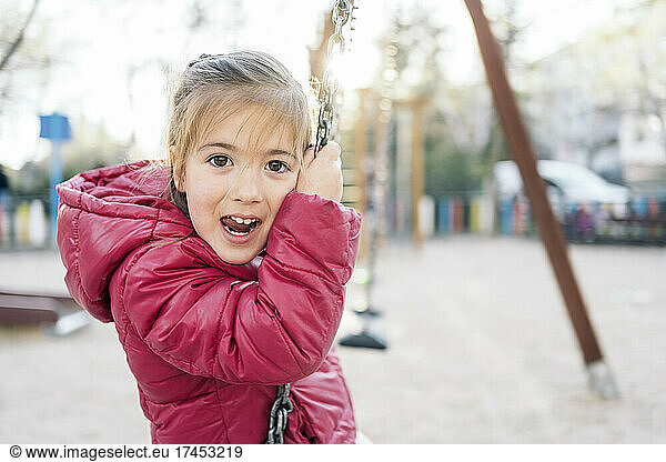 Portrait of a kid in the swing