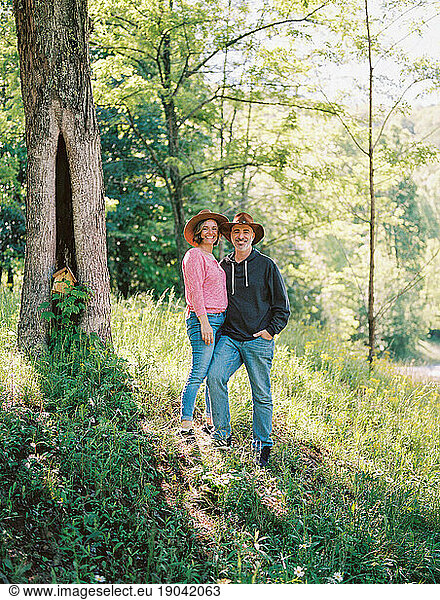 portrait of a middle aged couple in the lush forests of Ellijay  GA