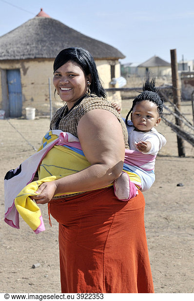 Portrait of a mother  South African Coloured with a child in a sling on her back  Lady Frere  Eastern Cape  South Africa  Africa