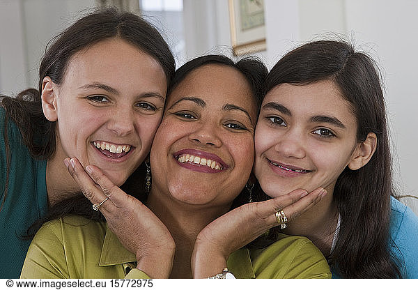 Portrait of a mother with two teenage daughters