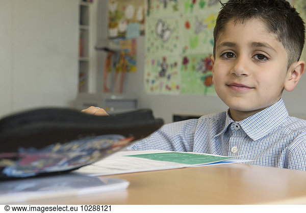 Portrait of a school boy taking exam in classroom  Munich  Bavaria  Germany