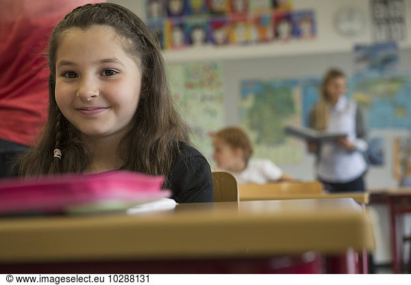 Portrait of a schoolgirl in classroom  Munich  Bavaria  Germany