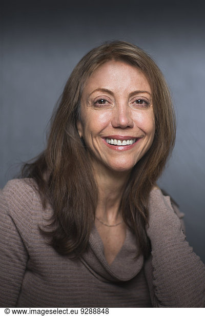 Portrait of a smiling middle aged woman.