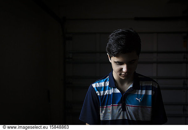 Portrait of a Teen Boy Looking Down