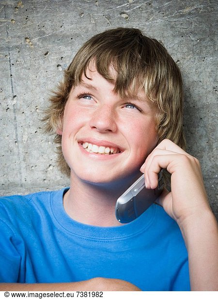 Portrait of a teenage boy using a mobile phone