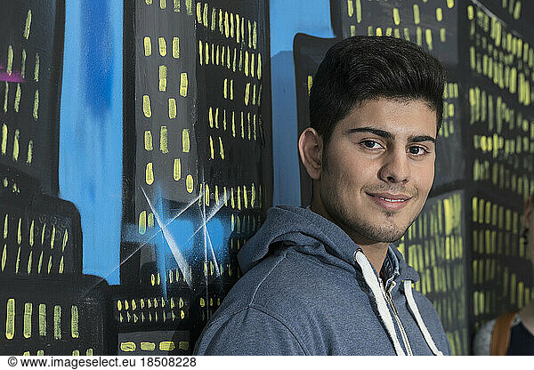 Portrait of a university student in front of graffiti wall School  Bavaria  Germany