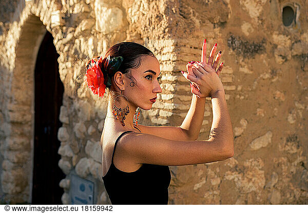 Portrait of a woman dancing flamenco at sunset