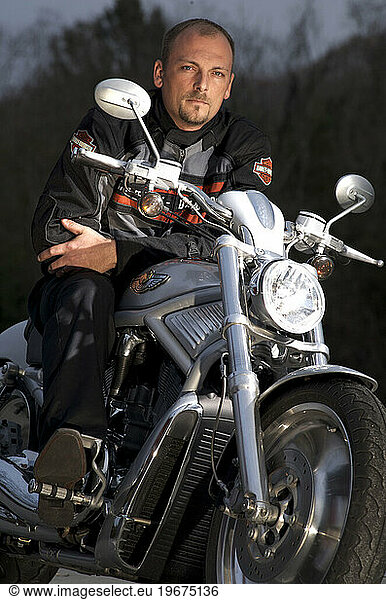 Portrait of a wounded Iraq war veteran on his Harley Davidson motorcycle