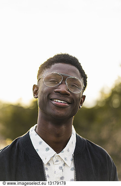 Portrait of a young black man  wearing a glasses