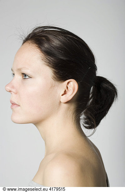 Portrait of a young brunette woman  profile