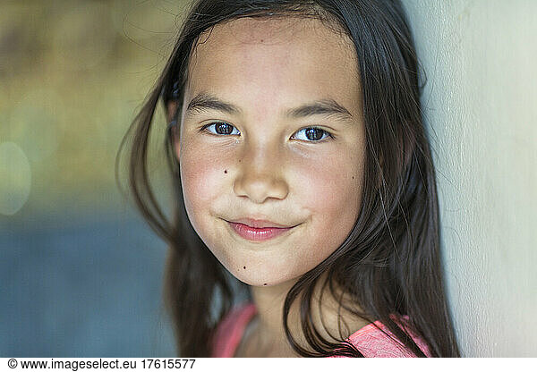 Portrait of a young girl with long brunette hair and brown eyes; Bangkok  Thailand