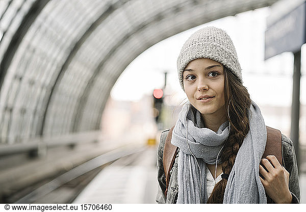 Portrait of a young woman waiting at the station platform  Berlin  Germany