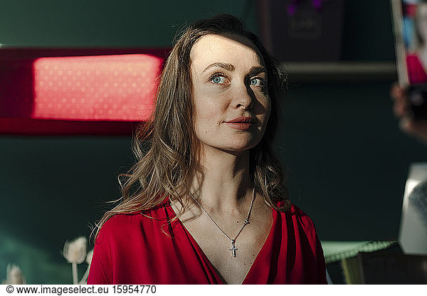 Portrait of beautiful woman in red dress