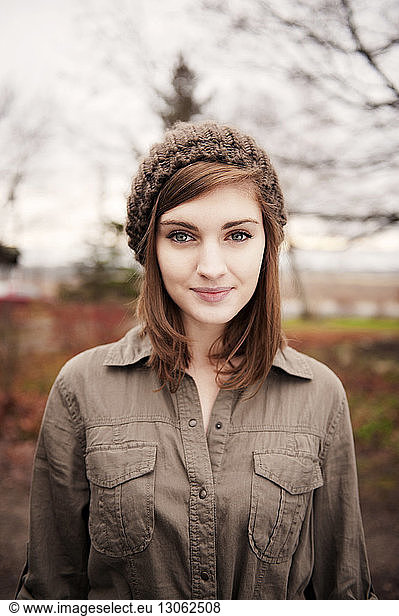 Portrait of beautiful woman with brown hair wearing knit hat