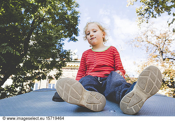 Portrait of blond little boy at playground