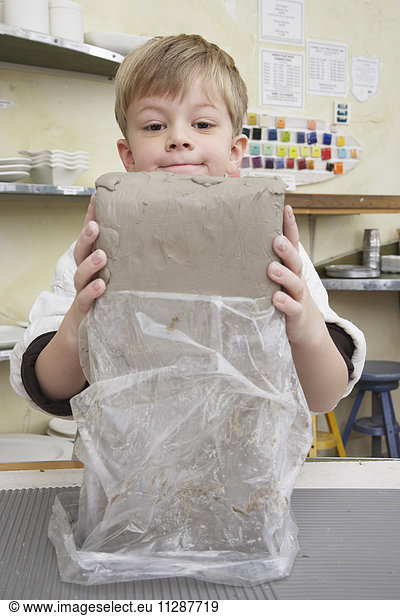 Portrait of Boy in Pottery Studio