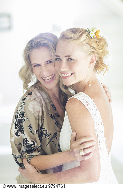 Portrait of bride and matron of honor at wedding reception