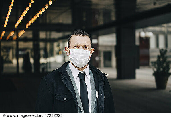Portrait of businessman with protective face mask