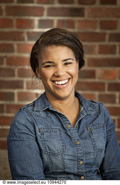 Portrait of cheerful mixed race woman