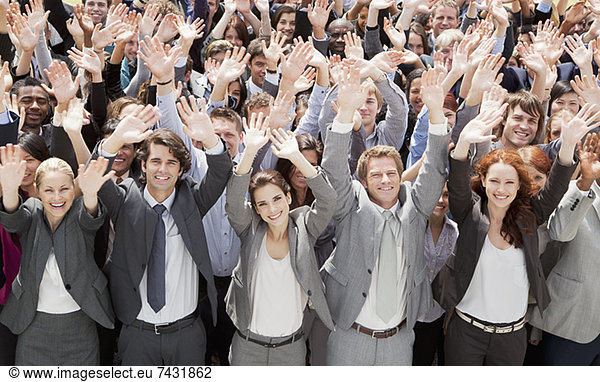 Portrait of cheering business people in crowd