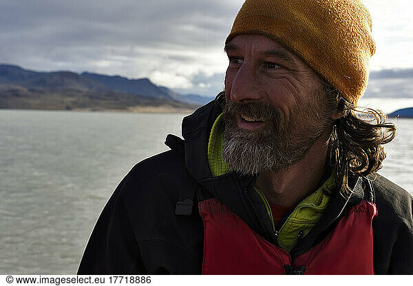 Portrait of chief boatman and reliable expedition member. Photograph taken whilst he was in total control of the Zodiac 3 inflatable boat on lake Centrum.