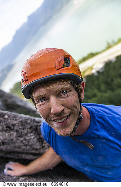 portrait of climber looking nice with helmet on a multipitch climb