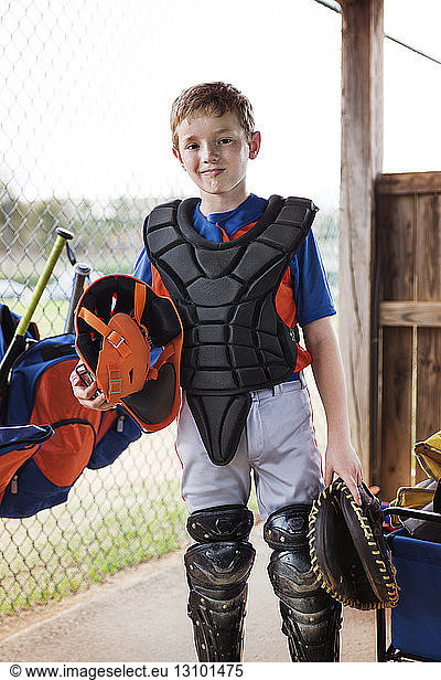 Portrait of confident baseball catcher at field