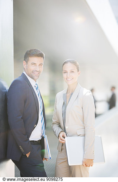 Portrait of confident business people outdoors