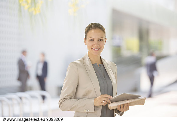 Portrait of confident businesswoman with digital tablet