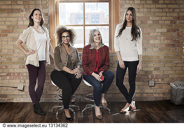 Portrait of confident businesswomen in creative office