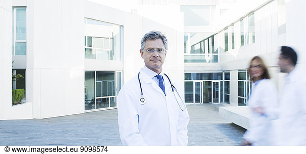 Portrait of confident doctor on rooftop