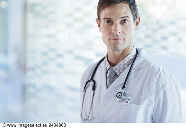 Portrait of confident doctor wearing lab coat