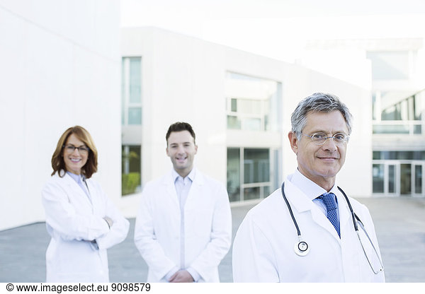 Portrait of confident doctors on rooftop