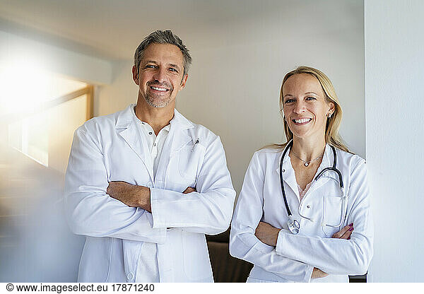 Portrait of confident male and female doctor
