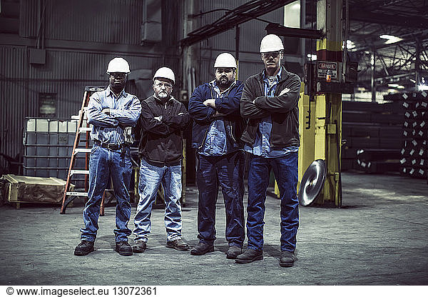 Portrait of confident workers in factory