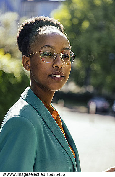 Portrait of confident young businesswoman wearing glasses