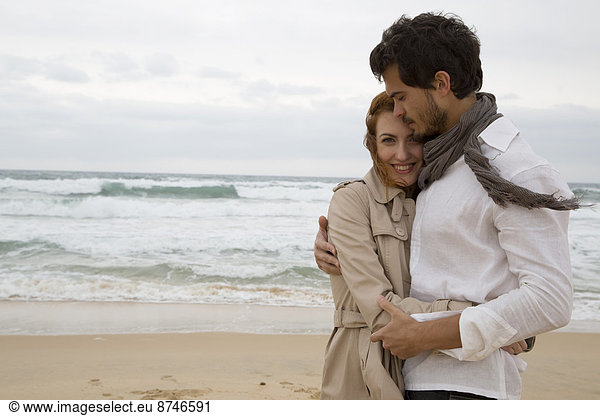 Portrait of Couple Hugging at Beach  Sardinia  Italy