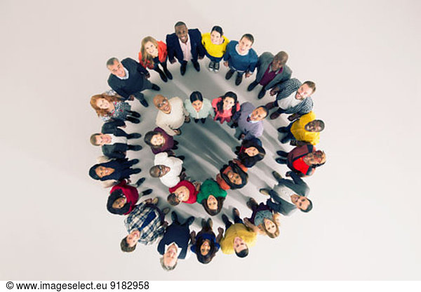 Portrait of diverse crowd in huddle
